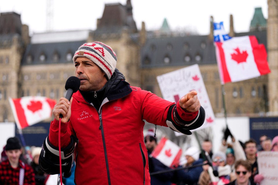Shaun Majumder speaking at a rally on Parliament Hill.