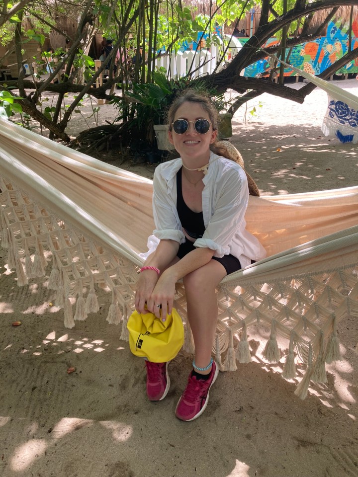 Woman sitting in a hammock on Corona Island.
