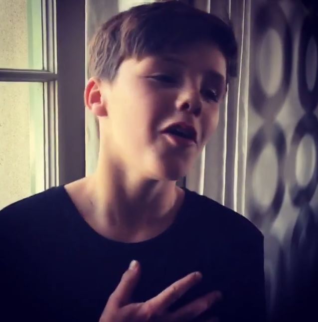 Cruz Beckham singing.