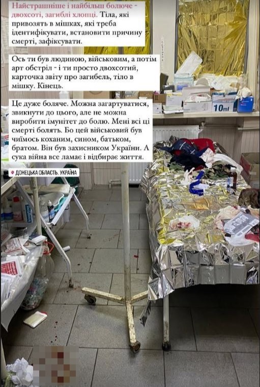 Photo of a hospital room with a body covered in a foil blanket.