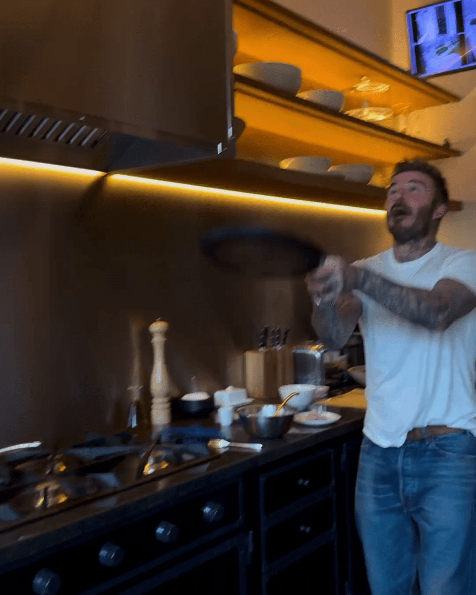 David Beckham cooking in his kitchen.