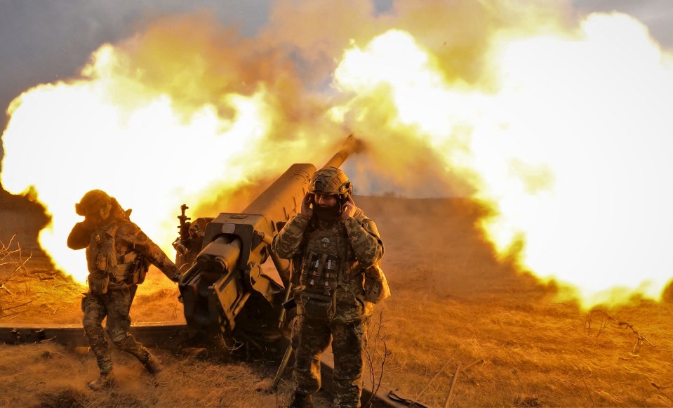 Ukrainian soldiers firing a howitzer near Bakhmut.