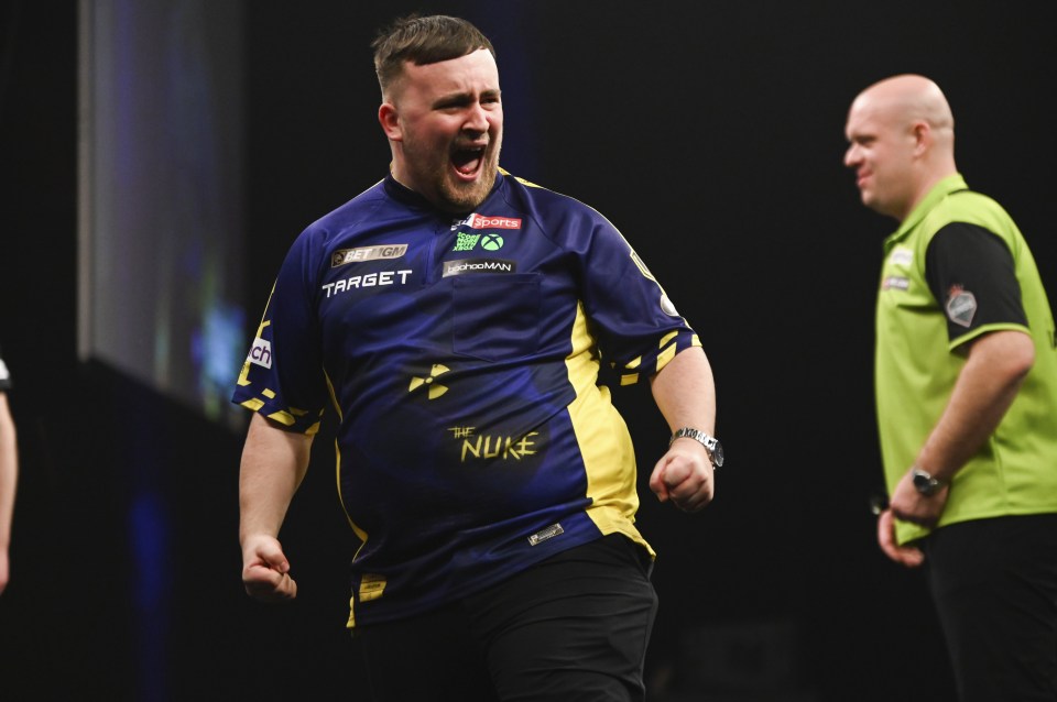 Luke Littler celebrating a nine-darter in a darts match.