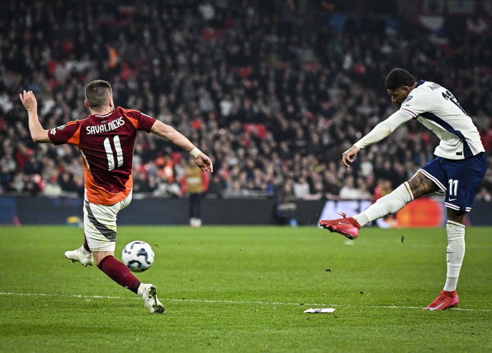 Soccer player kicking the ball during a game.