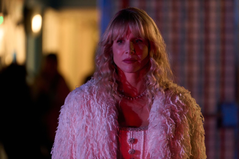 Lucy Punch in a feathered coat.