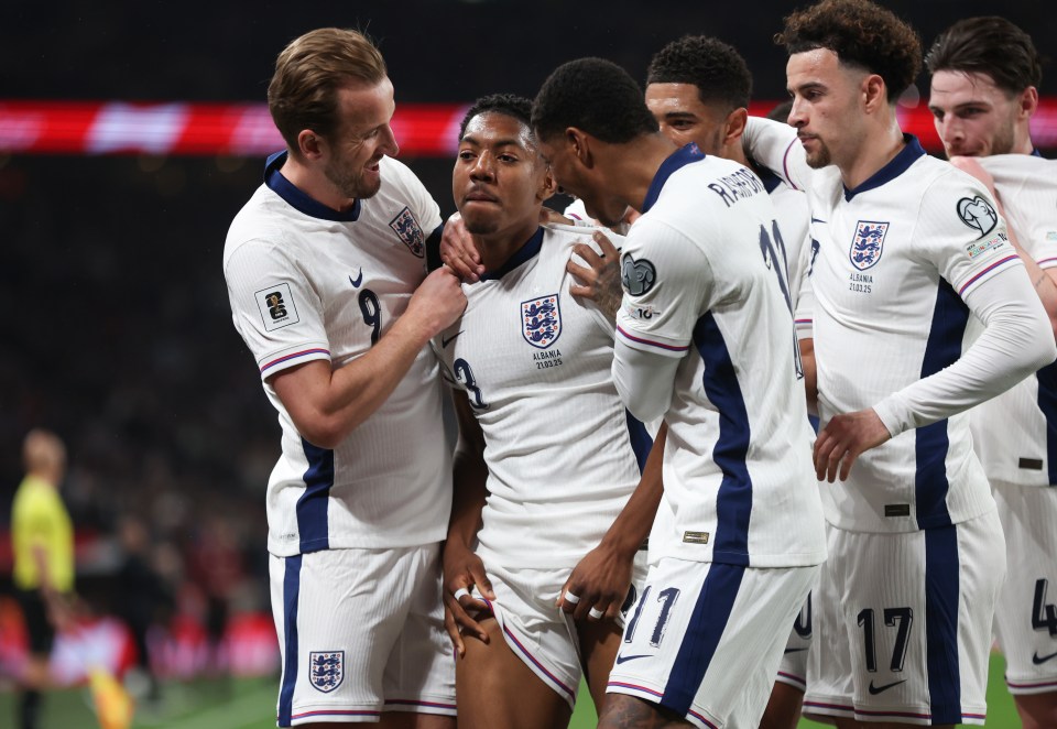 England soccer players celebrating a goal.