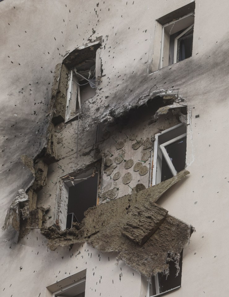 Damaged building exterior after a drone attack.