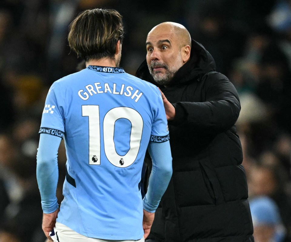 Pep Guardiola speaking with Jack Grealish.