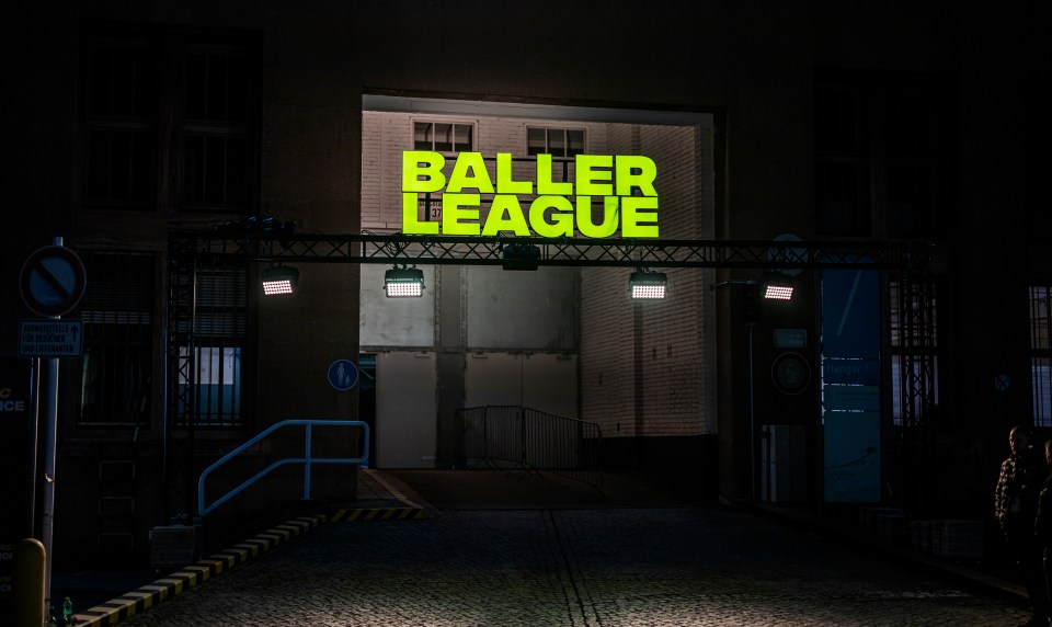 Baller League sign at night.