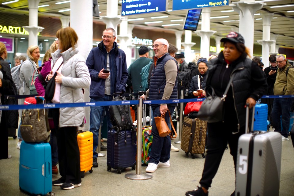 Passengers at St. Pancras International station after Eurostar train delays.