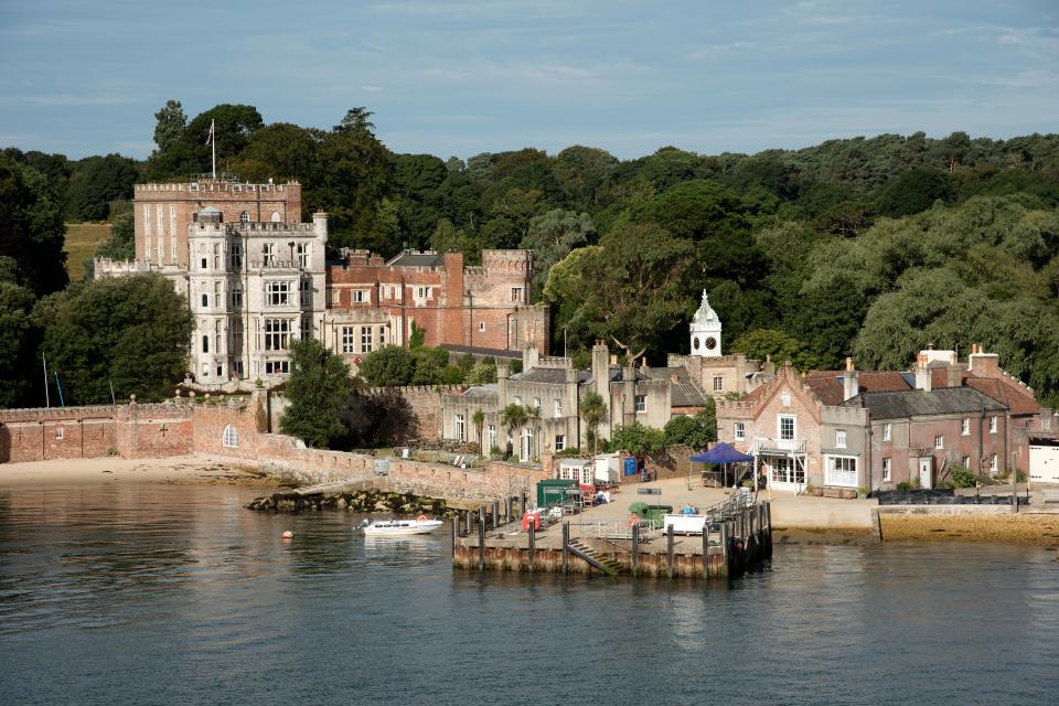 Brownsea Castle and harbor buildings on Brownsea Island.