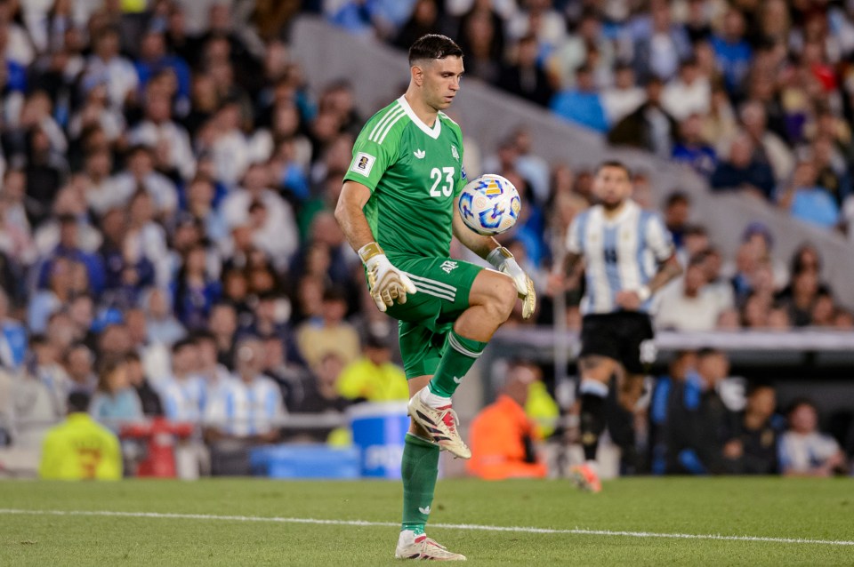 Emiliano Martínez, Argentina's goalkeeper, controls the ball during a soccer match.