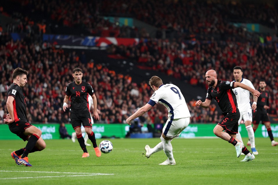 Harry Kane of England scoring a goal during a soccer match.