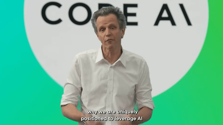 Man explaining how his company uniquely leverages AI.