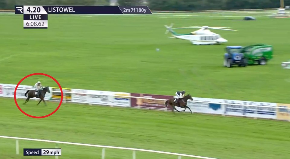 Horse race at Listowel; horse and jockey in the lead.