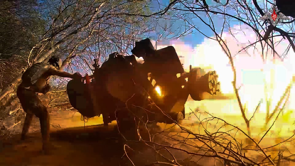 A Russian soldier fires a gun near the Ukrainian border.