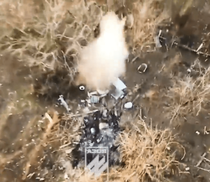 Debris field with a white object in the center.