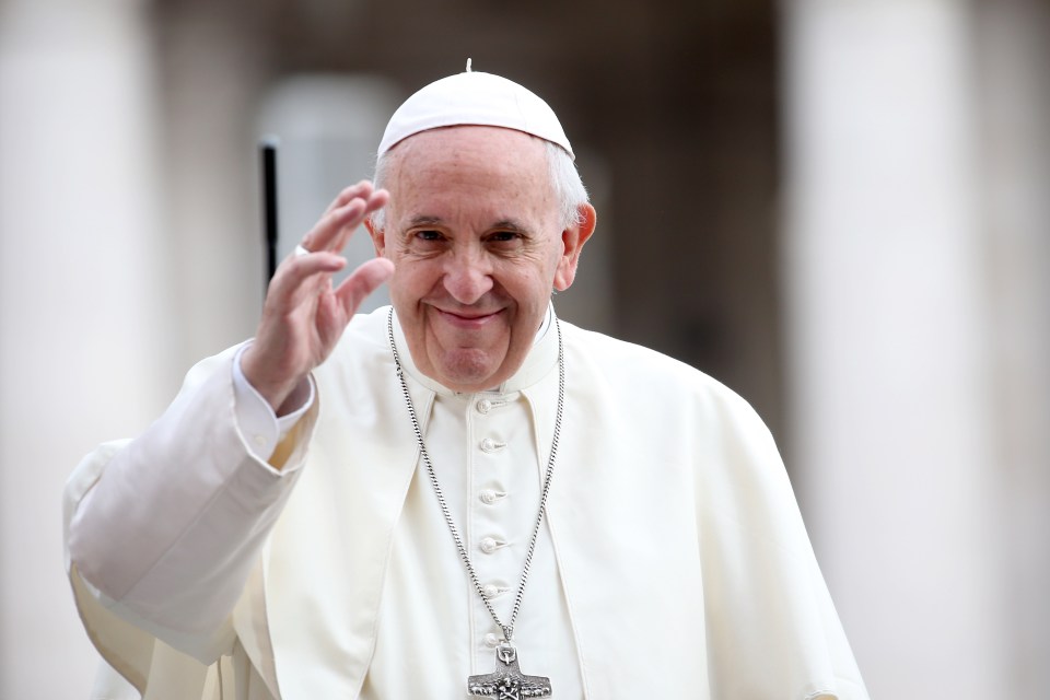 Pope Francis waving.