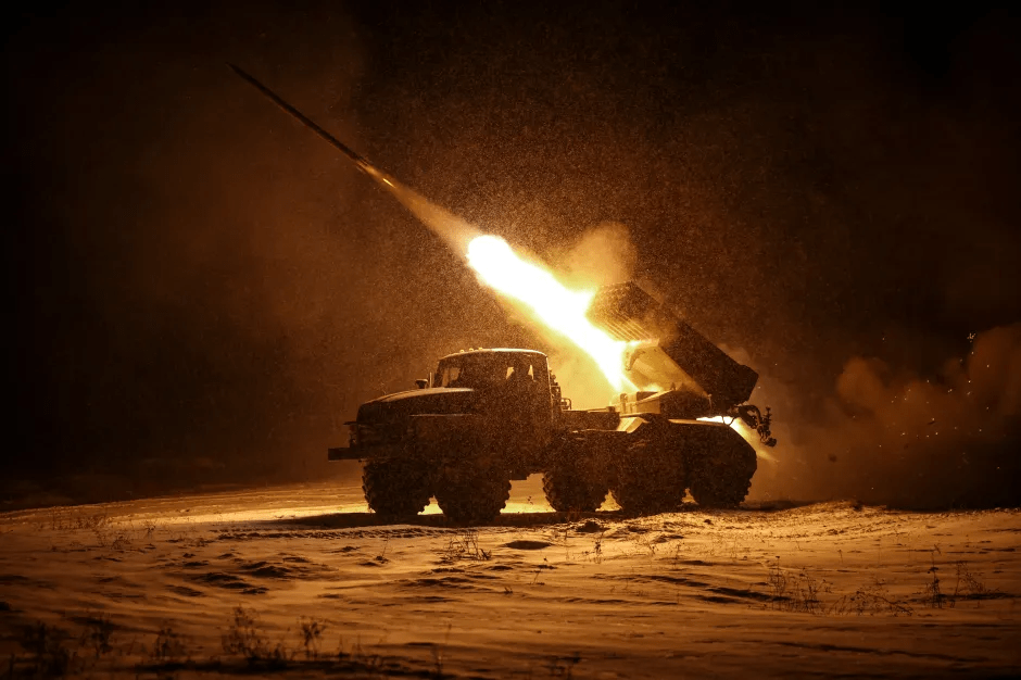 Missile launcher firing at night.