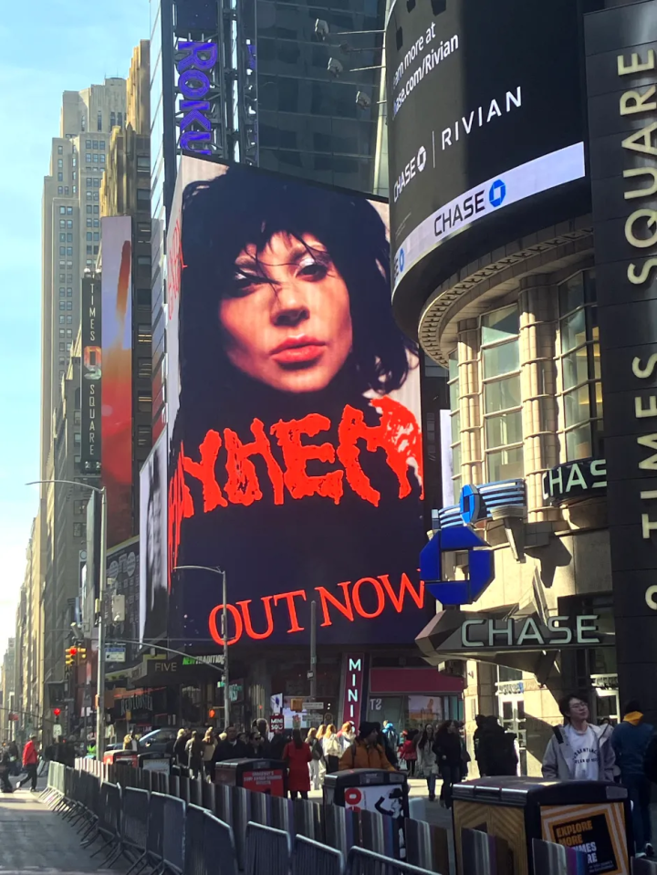 Billboard in Times Square advertising a new album.