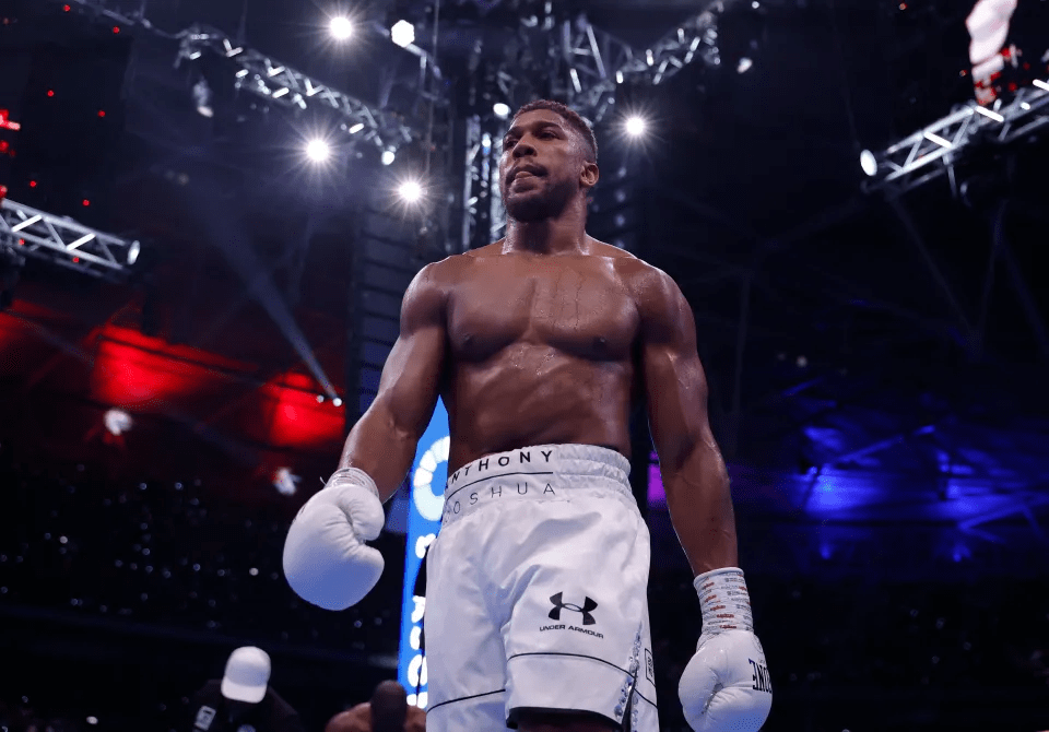 Anthony Joshua in boxing shorts and gloves.