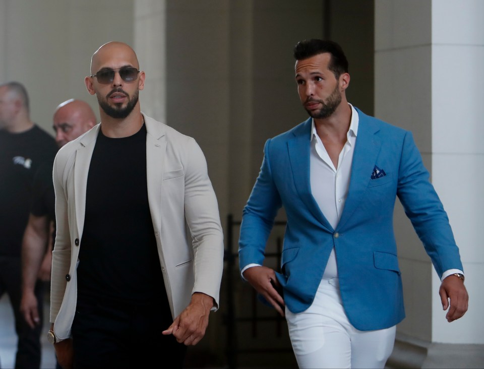 Two men in suits walking.