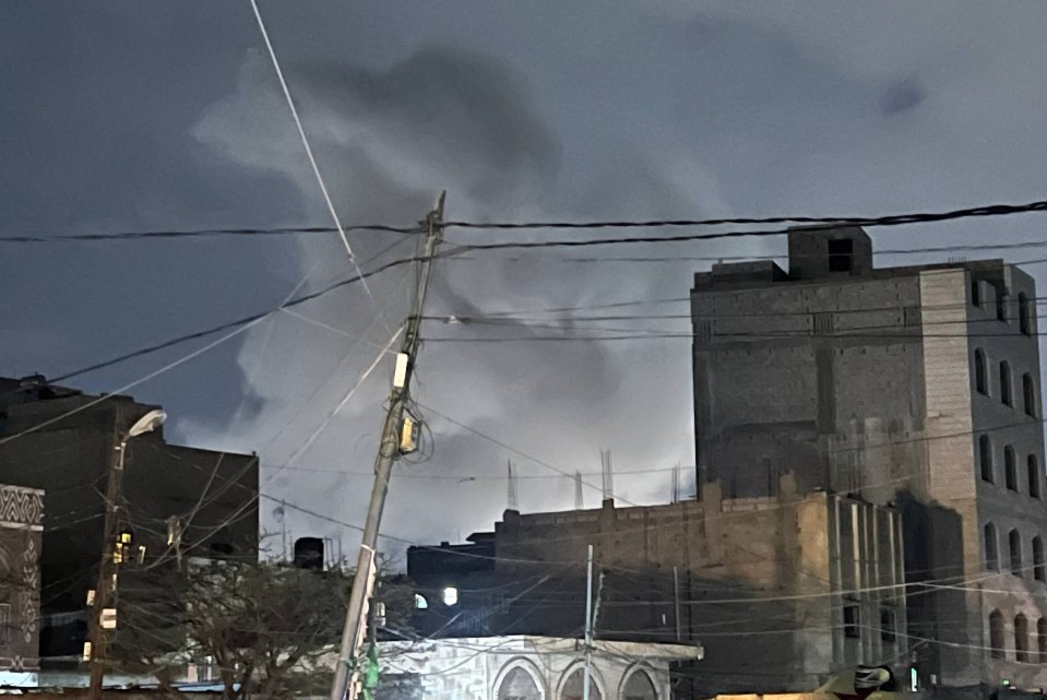 Storm clouds over city buildings.