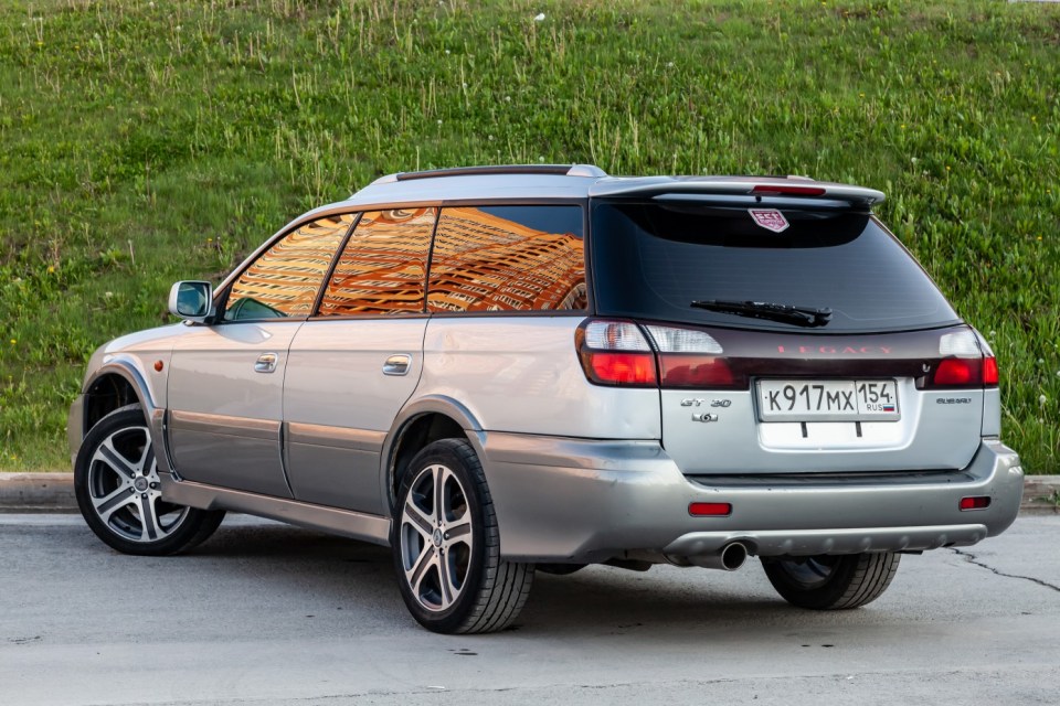 Pavlodar, Kazakhstan - 05.30.2023: Rear View of Subaru Legacy Lancaster  japanese car in beige color on the parking.