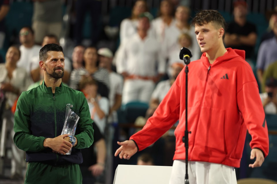 Novak Djokovic and Jakub Mensik at an awards ceremony.