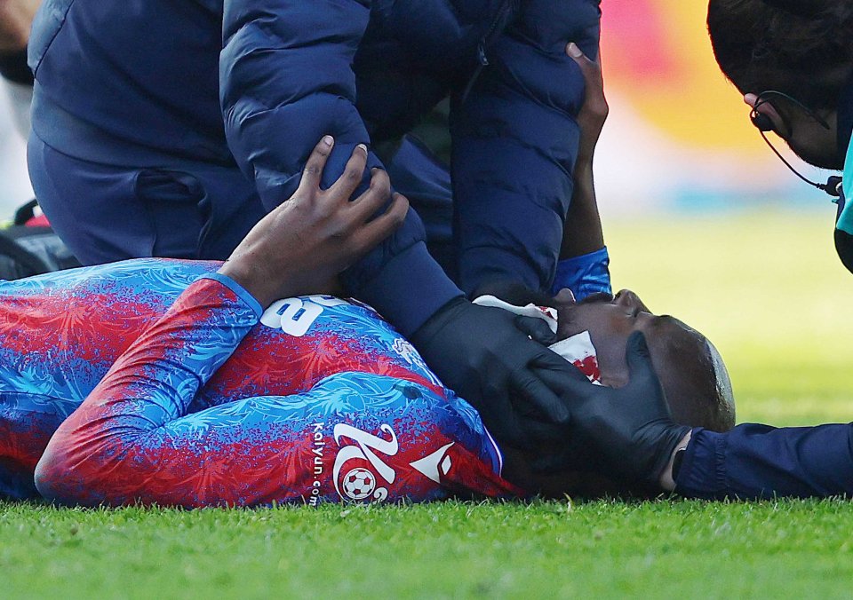 Soccer player receiving medical attention on the field.