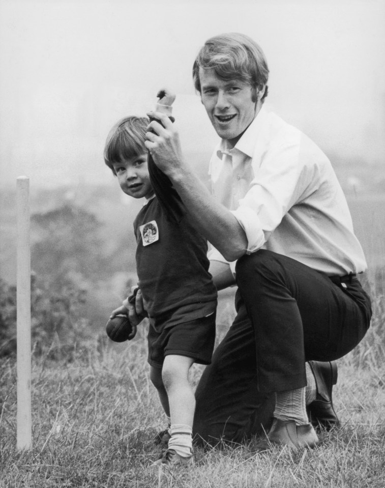 Black and white photo of cricketer Peter Lever playing cricket with his young son.
