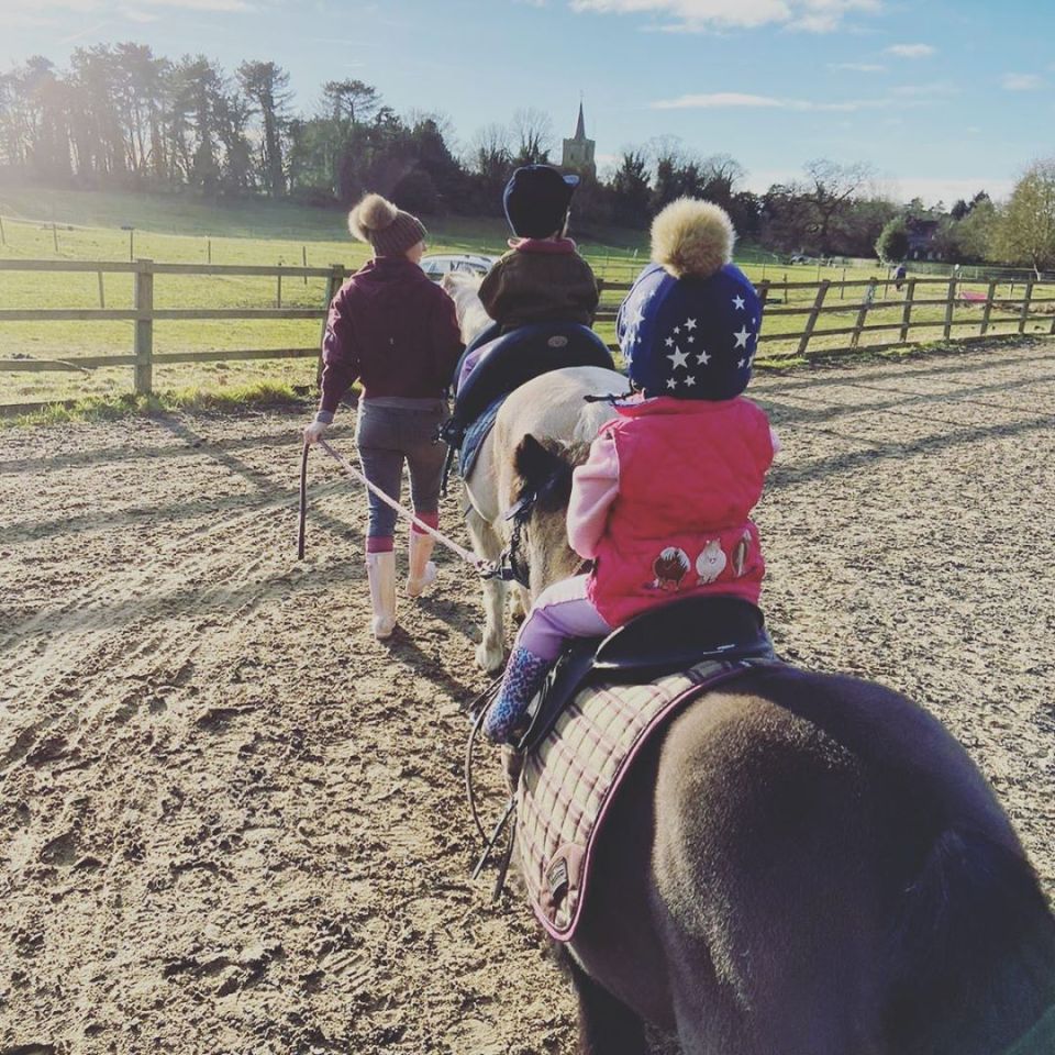 Children riding ponies.