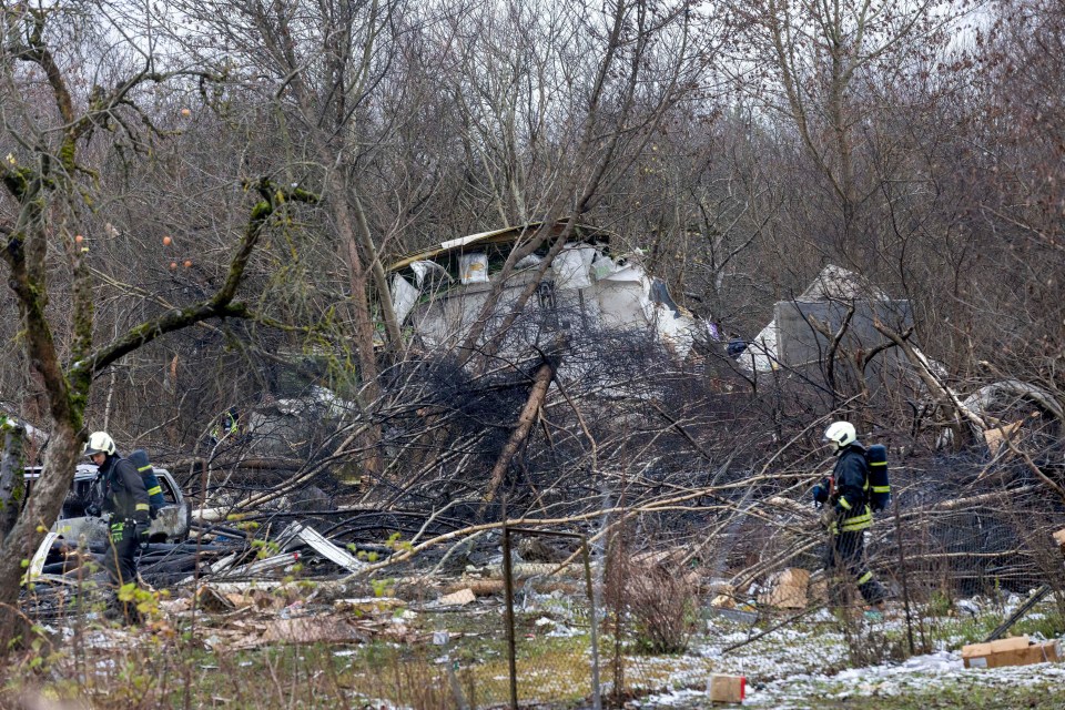 Firefighters at the site of a plane crash.
