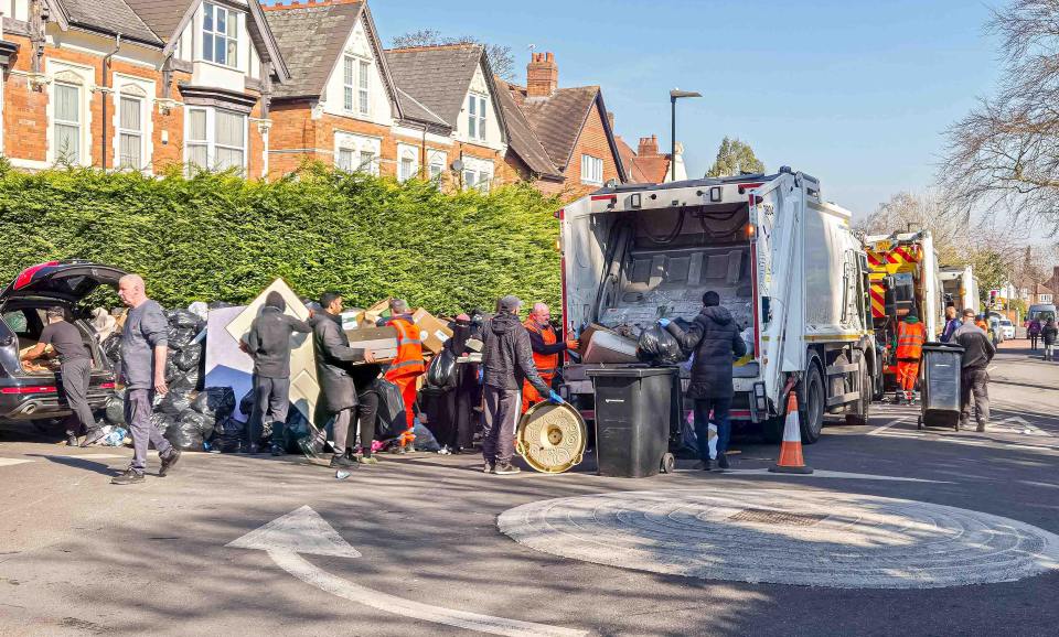 Residents overflowing waste bins during a refuse collector's strike.