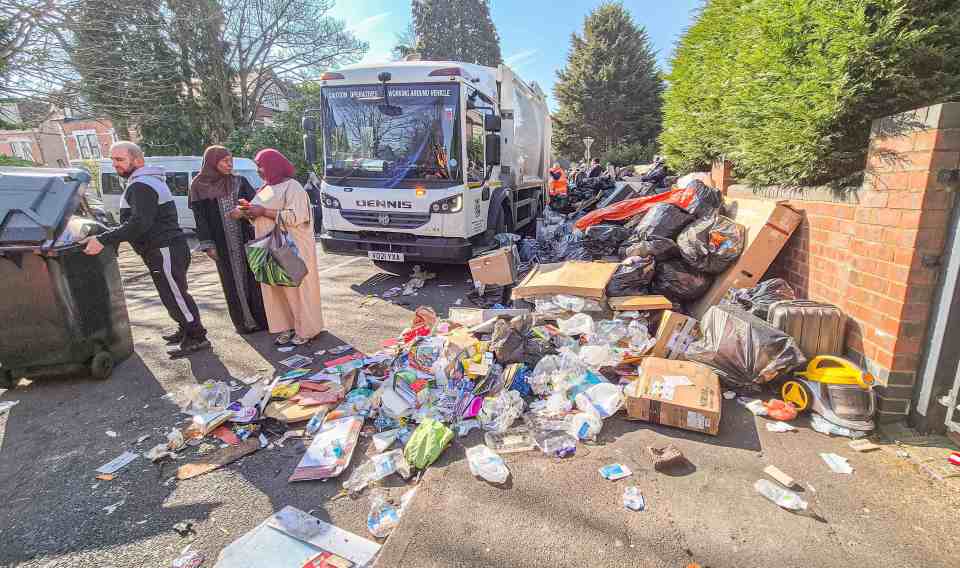 Overflowing trash piles on a residential street during a bin men's strike.