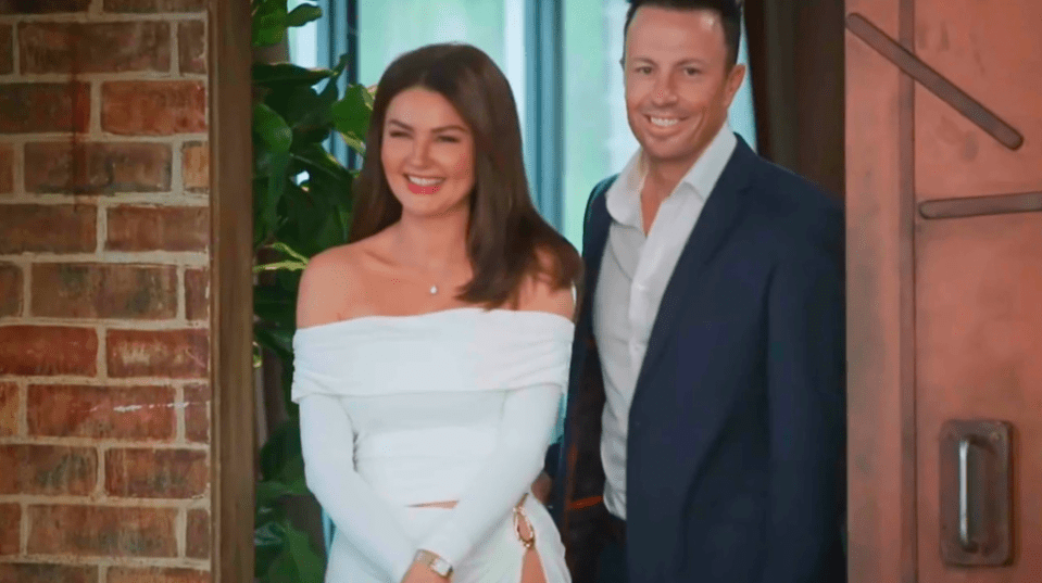A couple reunited at a dinner party.