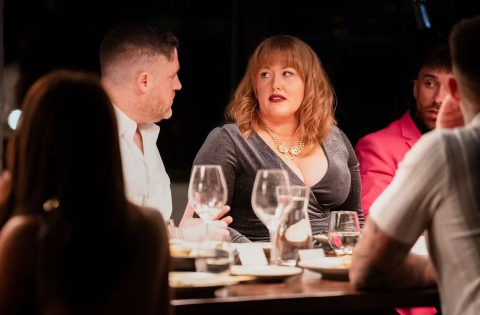A scene from Married at First Sight Australia showing Tim and Katie at a dinner party with other cast members.