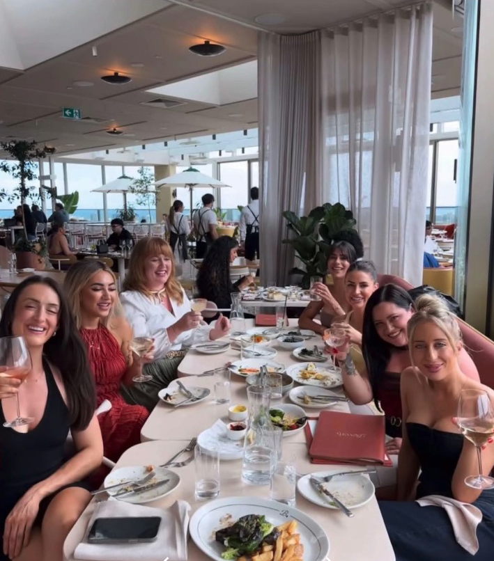 Group of women dining at a restaurant.