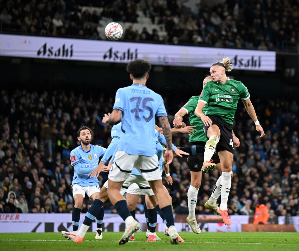 Maksym Talovierov of Plymouth Argyle scoring a goal during a soccer match.