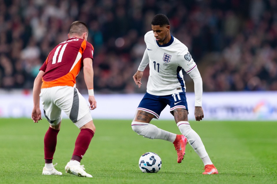 Marcus Rashford of England dribbling the soccer ball during a match.