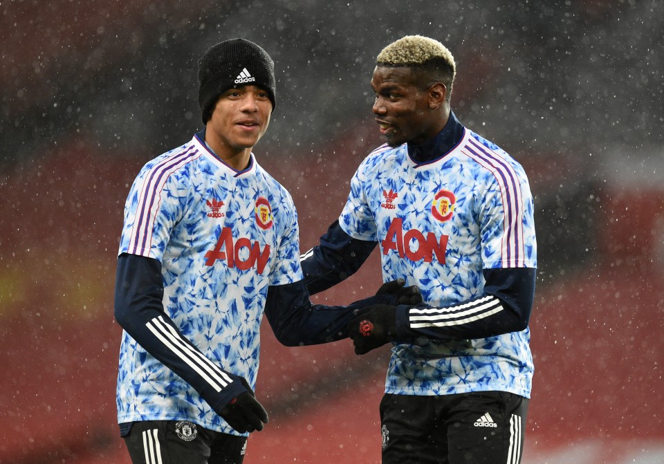 Mason Greenwood and Paul Pogba of Manchester United warming up before a match.