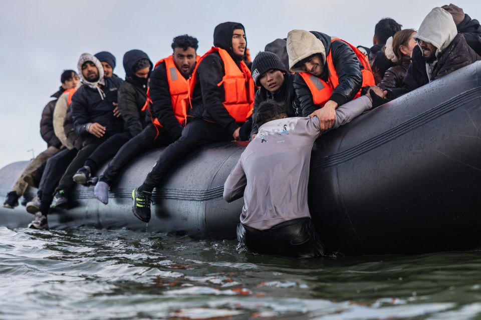 Migrants board a smuggler's boat.