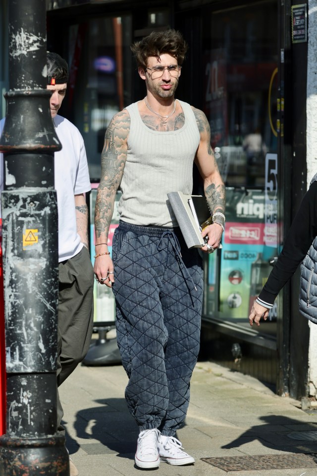 Chris Taylor, Love Island star, walking down the street.