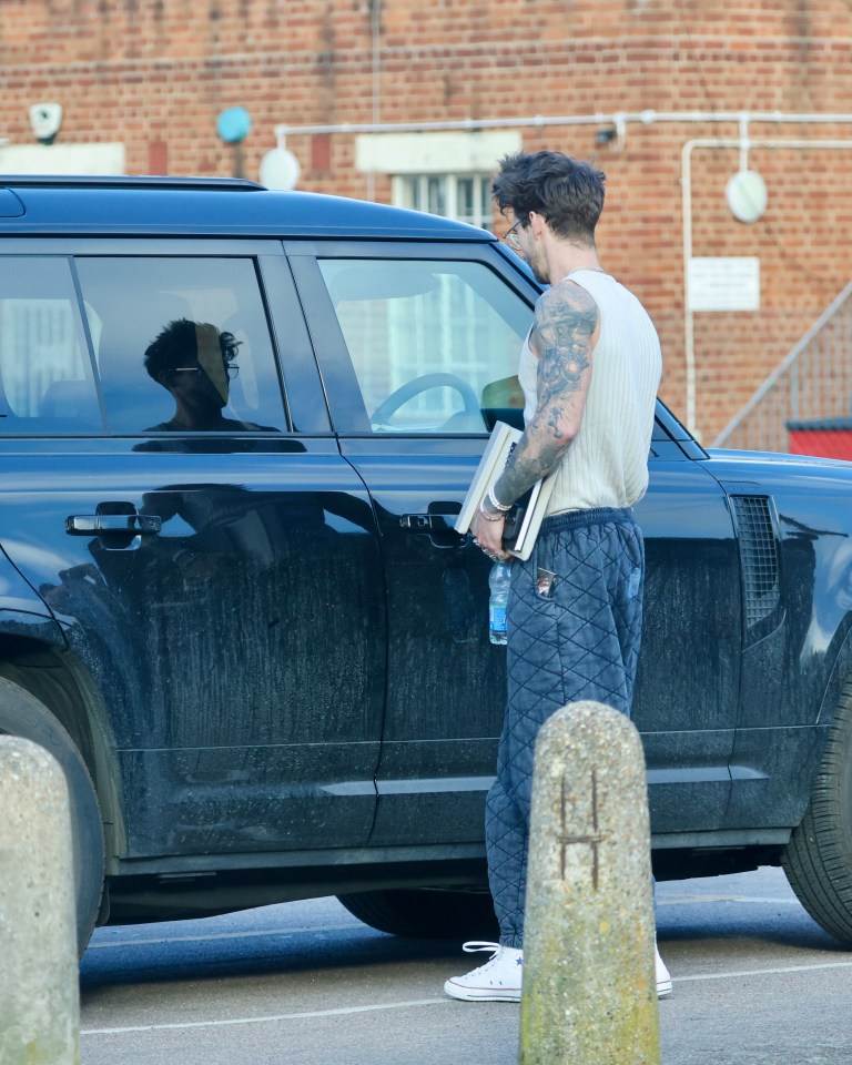 Chris Taylor, Love Island star, next to his new Land Rover Defender.