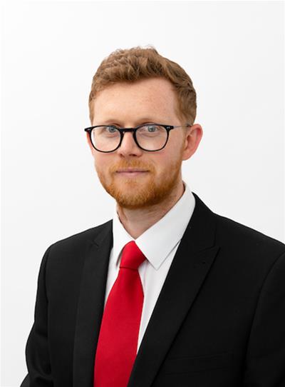 Headshot of Councillor Sam Gould.
