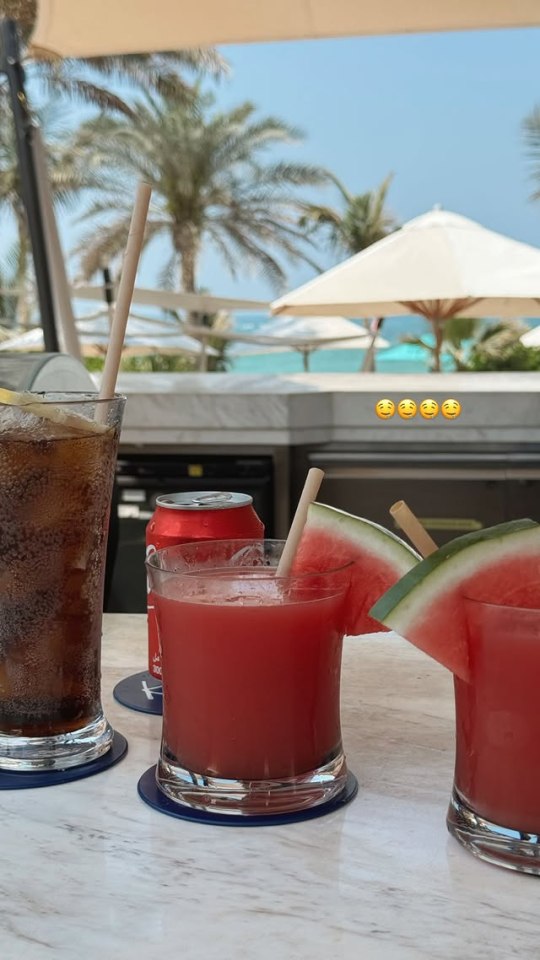 Watermelon drinks and cola by the beach.