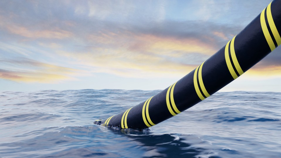 3D rendering of a submarine power cable being installed in the ocean.