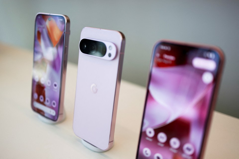 Three Google Pixel 9 smartphones on display.