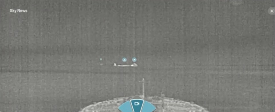 Thermal image of orcas in the water.