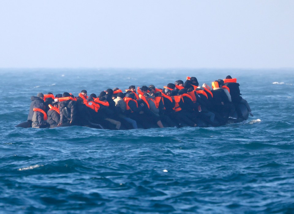 Overcrowded dinghy of migrants in the English Channel.